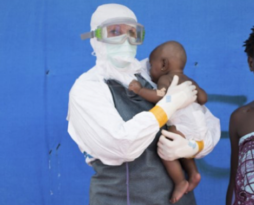 Jojo*, a young child who survived the 2014-2015 Ebola outbreak in Liberia, was cared for by health workers and her mother (right), also an Ebola survivor who was allowed to stay in the unit to care for her daughter.