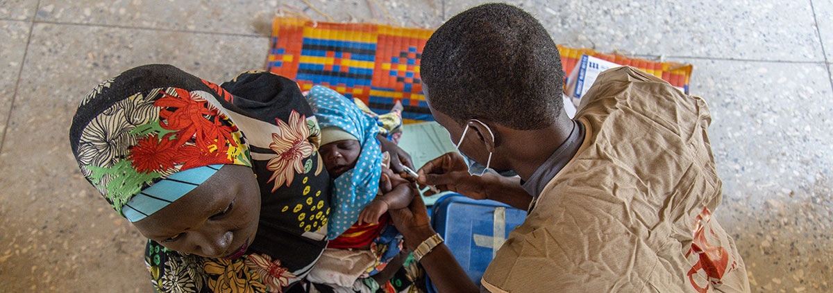 Healthworker Nura Ibrahim administers a vaccine at a school in a remote community in Jigawa State, Nigeria. Image credit: Yagazie Emezi / Save the Children